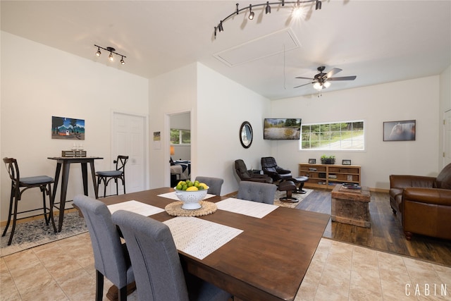 12520 Pinkham Creek Rd, Rexford, MT 59930 - tiled dining room featuring attic access, a ceiling fan, and baseboards