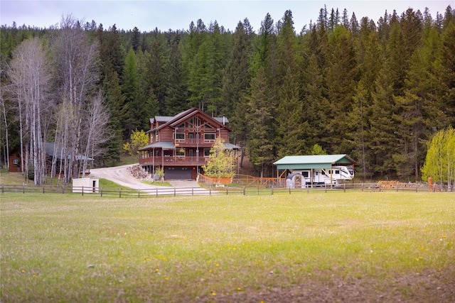 12520 Pinkham Creek Rd, Rexford, MT 59930 - view of yard featuring a wooded view and a deck