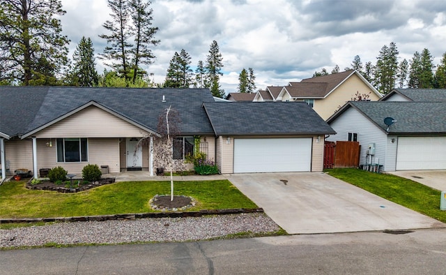 1091 Harmony Ct, Kalispell, MT 59901 - single story home featuring an attached garage, concrete driveway, and roof with shingles