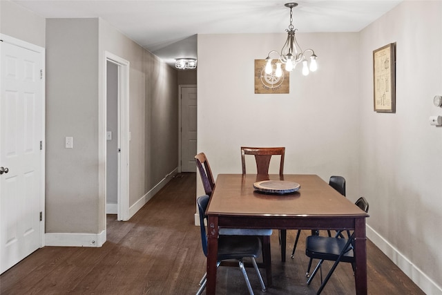 1091 Harmony Ct, Kalispell, MT 59901 - dining area with dark wood finished floors, baseboards, and a chandelier