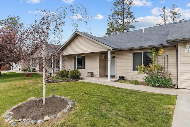 1091 Harmony Ct, Kalispell, MT 59901 - single story home with a front yard and a shingled roof