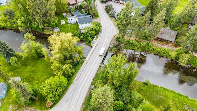 1091 Harmony Ct, Kalispell, MT 59901 - drone / aerial view of a large body of water, a major roadway, and a tree filled landscape
