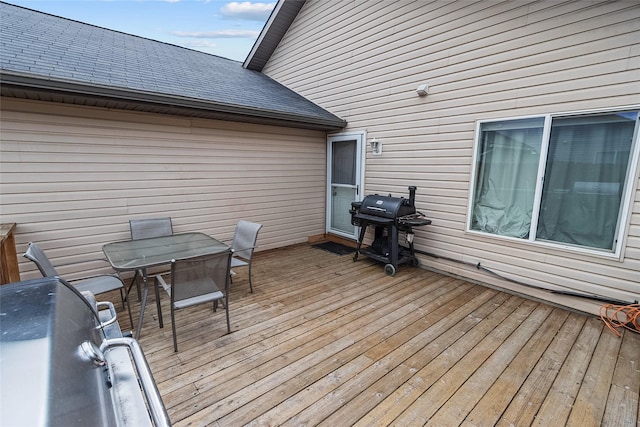 1091 Harmony Ct, Kalispell, MT 59901 - deck with area for grilling and outdoor dining area