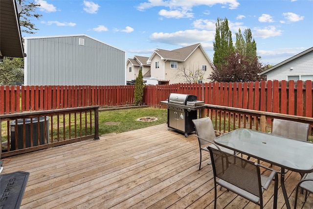 1091 Harmony Ct, Kalispell, MT 59901 - deck featuring area for grilling, an outdoor fire pit, a residential view, and outdoor dining area
