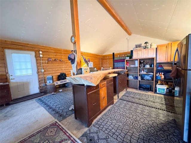 222 S Fork Ray Creek Rd, Townsend, MT 59644 - kitchen featuring rustic walls, freestanding refrigerator, and light colored carpet