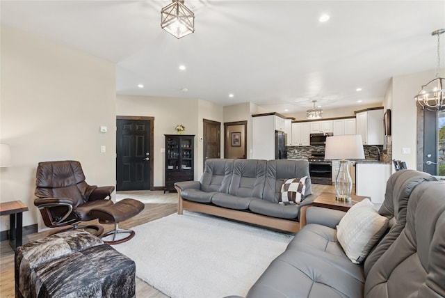 1066 Mill Creek Drive Mill Creek Drive, Bigfork, MT 59911 - living room featuring light wood-style floors, a chandelier, and recessed lighting