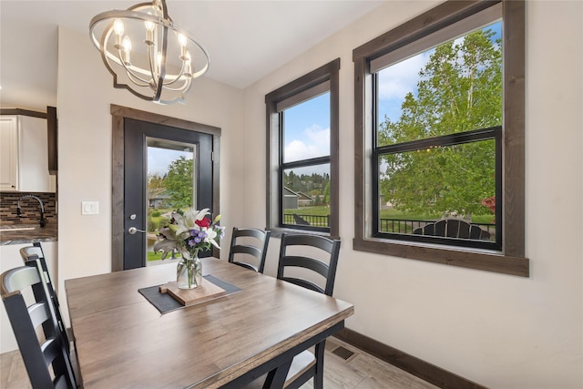 1066 Mill Creek Drive Mill Creek Drive, Bigfork, MT 59911 - dining space with a chandelier and baseboards
