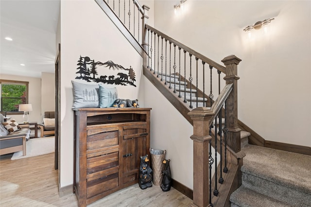 1066 Mill Creek Drive Mill Creek Drive, Bigfork, MT 59911 - staircase featuring wood finished floors, baseboards, and recessed lighting