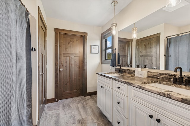 1066 Mill Creek Drive Mill Creek Drive, Bigfork, MT 59911 - bathroom with double vanity, baseboards, curtained shower, and marble look tile flooring
