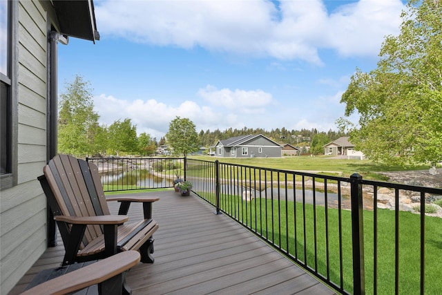1066 Mill Creek Drive Mill Creek Drive, Bigfork, MT 59911 - wooden terrace with a water view, a yard, and a residential view