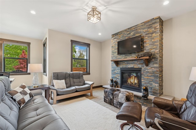 1066 Mill Creek Drive Mill Creek Drive, Bigfork, MT 59911 - living area with wood finished floors, a stone fireplace, and recessed lighting