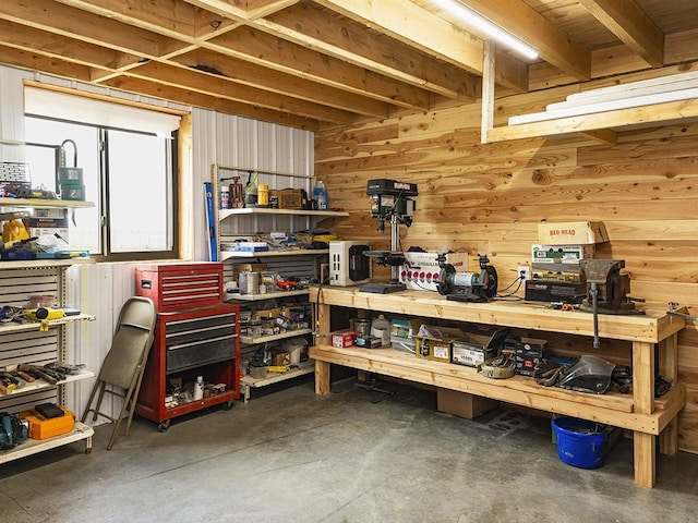 89 Wild Rose Trl, Roberts, MT 59070 - miscellaneous room featuring a workshop area, concrete floors, and wood walls