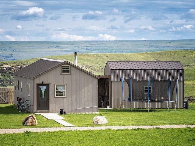 89 Wild Rose Trl, Roberts, MT 59070 - view of outdoor structure with a trampoline