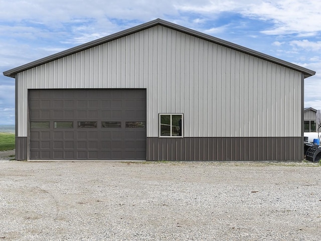 89 Wild Rose Trl, Roberts, MT 59070 - view of home's exterior with an outbuilding, a detached garage, and board and batten siding