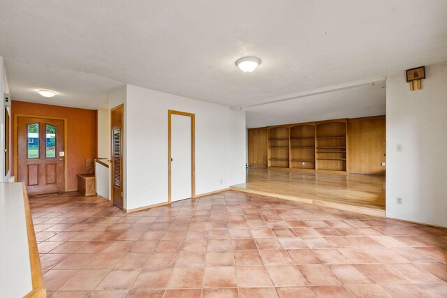 160 Sherwood Ln, Kalispell, MT 59901 - empty room featuring light tile patterned flooring and built in features