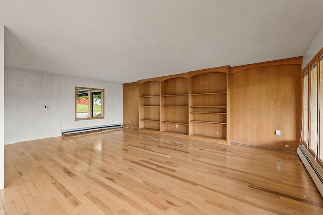 160 Sherwood Ln, Kalispell, MT 59901 - unfurnished living room with a baseboard radiator and light wood finished floors