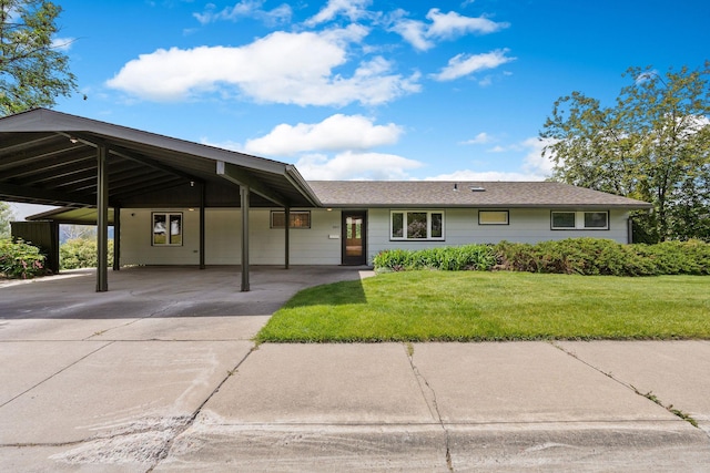160 Sherwood Ln, Kalispell, MT 59901 - view of front of property with an attached carport, concrete driveway, and a front lawn