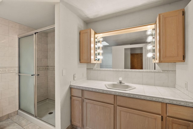 160 Sherwood Ln, Kalispell, MT 59901 - bathroom with vanity, a shower stall, tasteful backsplash, and tile patterned flooring