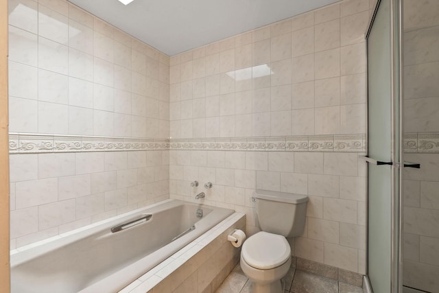 160 Sherwood Ln, Kalispell, MT 59901 - bathroom featuring tile walls, a garden tub, toilet, and tiled shower