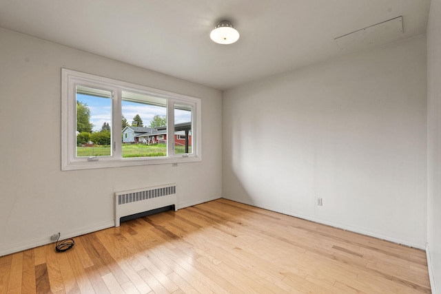 160 Sherwood Ln, Kalispell, MT 59901 - unfurnished room with radiator and light wood-type flooring