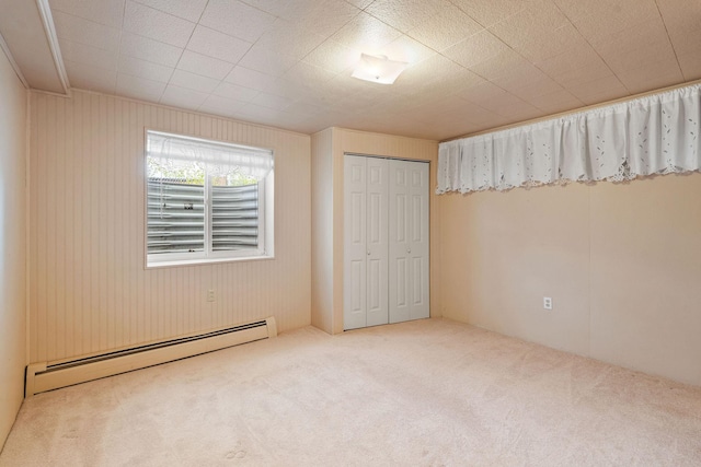 160 Sherwood Ln, Kalispell, MT 59901 - unfurnished bedroom with a baseboard heating unit, carpet, and a closet