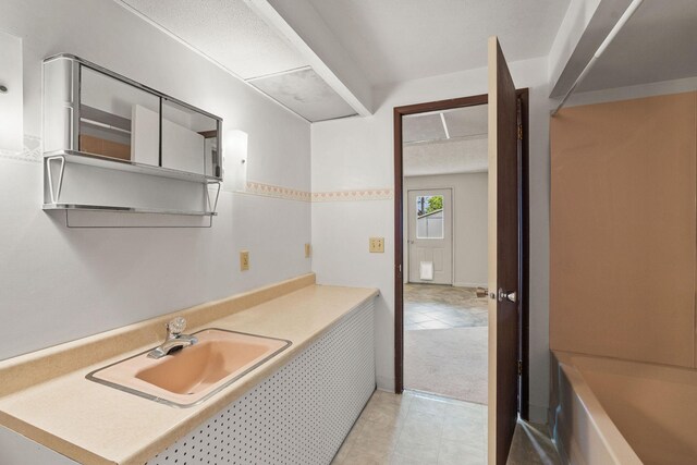 160 Sherwood Ln, Kalispell, MT 59901 - bathroom featuring vanity, tile patterned floors, and a bath