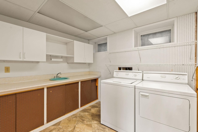 160 Sherwood Ln, Kalispell, MT 59901 - laundry area with washing machine and clothes dryer and cabinet space