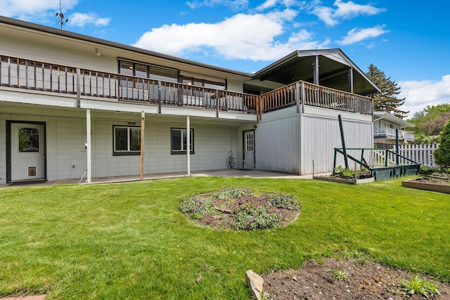 160 Sherwood Ln, Kalispell, MT 59901 - back of property featuring a vegetable garden, a yard, and a patio area