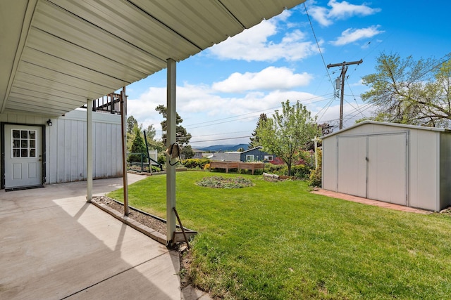 160 Sherwood Ln, Kalispell, MT 59901 - view of grassy yard featuring a patio area