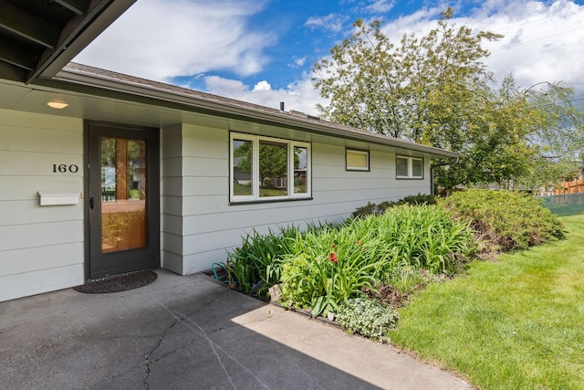 160 Sherwood Ln, Kalispell, MT 59901 - doorway to property featuring a lawn