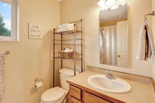 2795 Renae Ct, Missoula, MT 59804 - full bath featuring vanity, toilet, and a shower with shower curtain