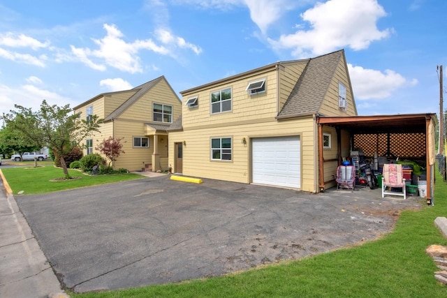 2795 Renae Ct, Missoula, MT 59804 - view of front facade with a garage, asphalt driveway, and a front yard