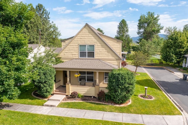 2795 Renae Ct, Missoula, MT 59804 - view of front of home with covered porch, a front lawn, and roof with shingles