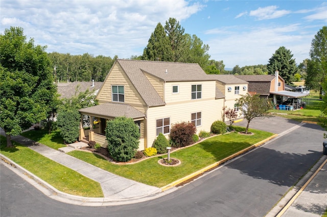 2795 Renae Ct, Missoula, MT 59804 - view of front facade featuring a front lawn, driveway, and a shingled roof