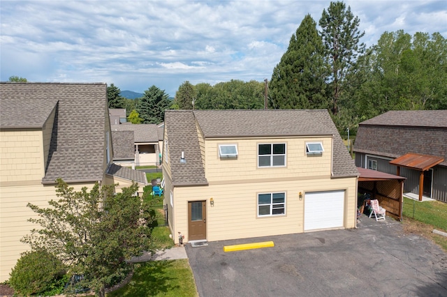 2795 Renae Ct, Missoula, MT 59804 - view of front of property with a shingled roof, asphalt driveway, and an attached garage