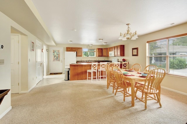 2795 Renae Ct, Missoula, MT 59804 - dining area featuring light colored carpet and a chandelier