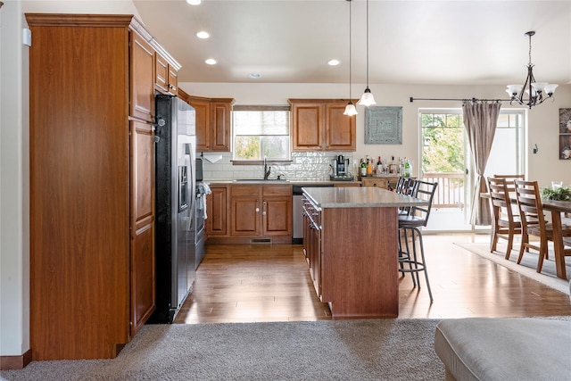 89 Alyvia Ln, Butte, MT 59701 - kitchen with a sink, appliances with stainless steel finishes, plenty of natural light, a kitchen breakfast bar, and recessed lighting