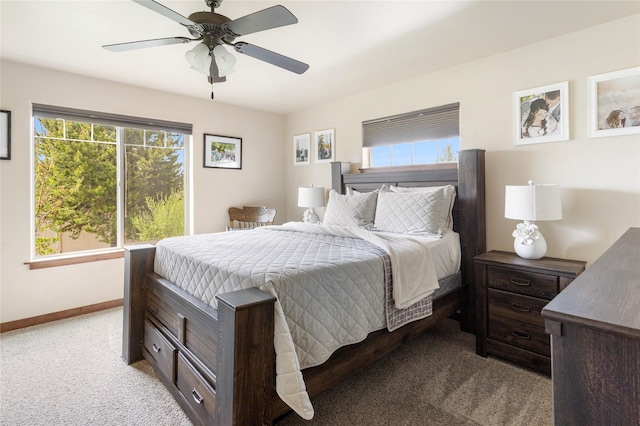 89 Alyvia Ln, Butte, MT 59701 - bedroom with light colored carpet, baseboards, and a ceiling fan