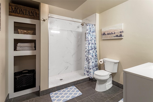 89 Alyvia Ln, Butte, MT 59701 - full bath featuring toilet, a shower stall, vanity, and tile patterned floors