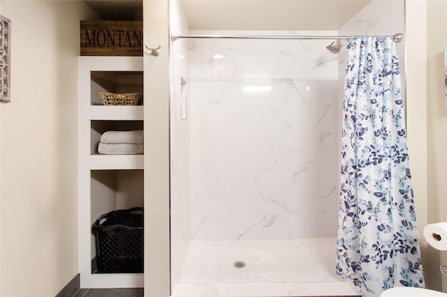 89 Alyvia Ln, Butte, MT 59701 - bathroom with curtained shower, toilet, and built in features