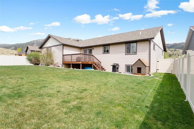 89 Alyvia Ln, Butte, MT 59701 - rear view of property featuring a deck with mountain view, a gate, stairway, and a shingled roof