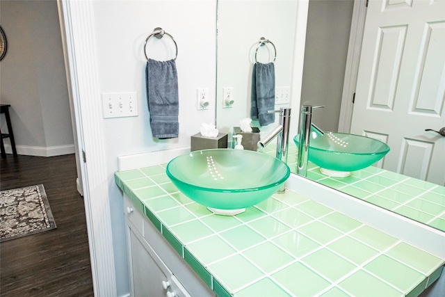 883 Saint Andrews Dr, Columbia Falls, MT 59912 - bathroom featuring wood finished floors, vanity, and baseboards