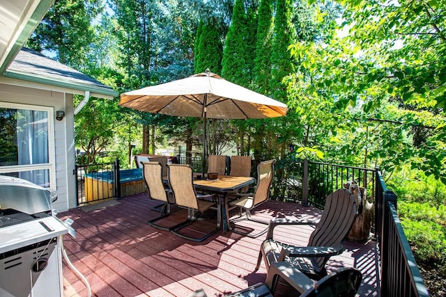 883 Saint Andrews Dr, Columbia Falls, MT 59912 - wooden terrace with outdoor dining area and grilling area