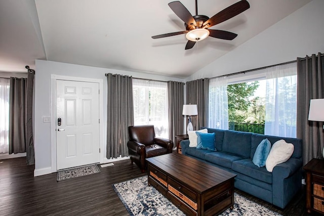 883 Saint Andrews Dr, Columbia Falls, MT 59912 - living area featuring lofted ceiling, healthy amount of natural light, ceiling fan, wood finished floors, and baseboards