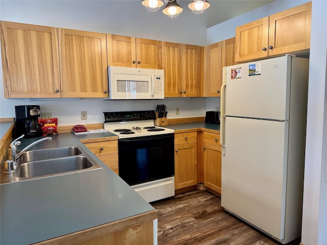 883 Saint Andrews Dr, Columbia Falls, MT 59912 - kitchen featuring white appliances, a sink, dark wood-type flooring, and a chandelier