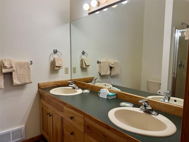 883 Saint Andrews Dr, Columbia Falls, MT 59912 - full bath featuring a stall shower, double vanity, and toilet