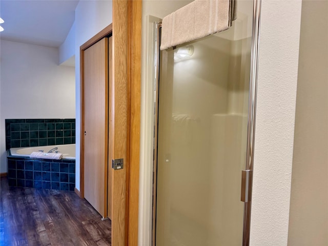 883 Saint Andrews Dr, Columbia Falls, MT 59912 - bathroom featuring wood finished floors, a shower stall, and a bath