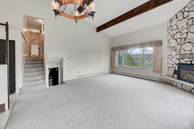 15 Vigilante Trl, Clancy, MT 59634 - unfurnished living room with a baseboard radiator, a fireplace, high vaulted ceiling, beamed ceiling, and stairs