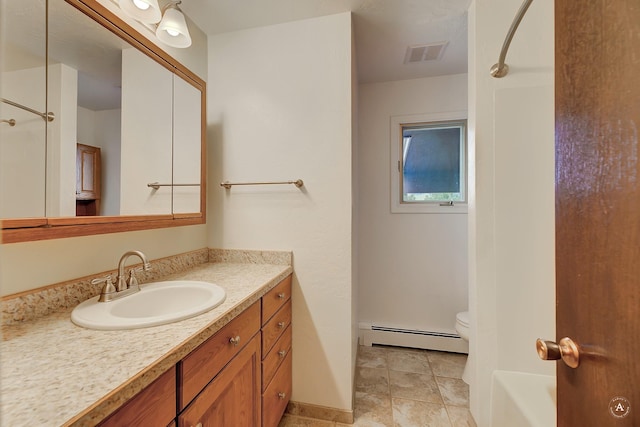 15 Vigilante Trl, Clancy, MT 59634 - bathroom with a baseboard radiator, vanity, toilet,  shower combination, and baseboards
