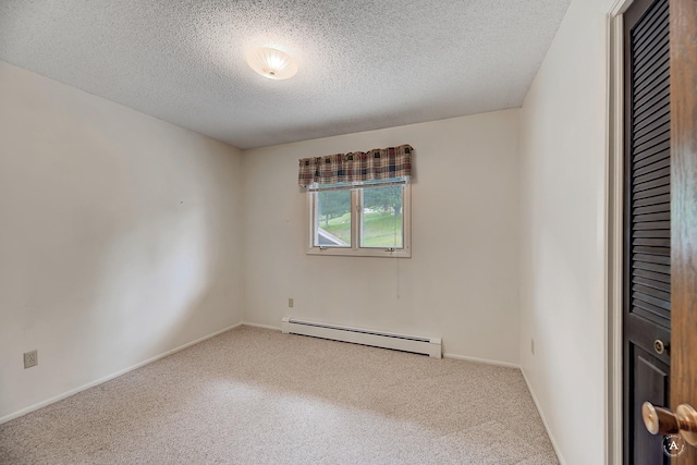 15 Vigilante Trl, Clancy, MT 59634 - spare room with a baseboard radiator, carpet, a textured ceiling, and baseboards